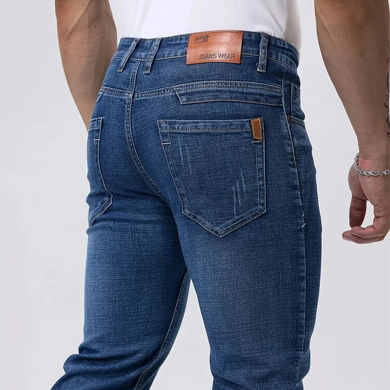 Blue jeans with a visible brand label on a white background