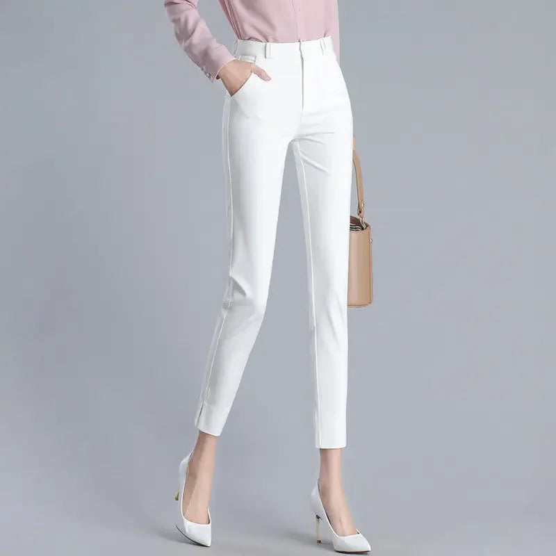 White pants worn by a person on a gray background
