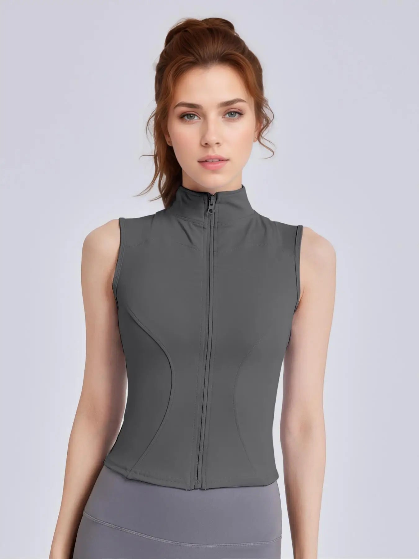 Women's Sleeveless Sports Vest with Thumb Hole Design and Zip-Up Closure