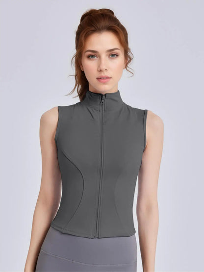 Women's Sleeveless Sports Vest with Thumb Hole Design and Zip-Up Closure