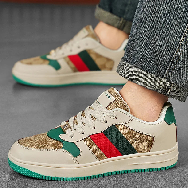 Beige sneakers with colorful stripes worn by a person on a gray surface