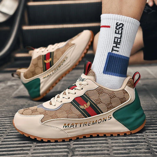 Beige sneakers with colorful accents and 'MATTREMONS' branding worn with white socks.